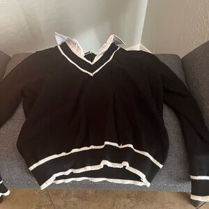 Elegant Black V-Neck Sweater with White Trim